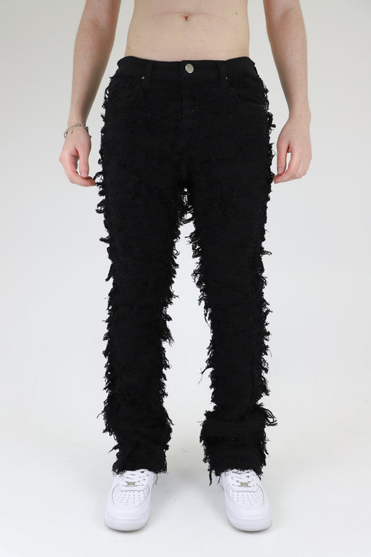 Front view of black fitted jeans showcasing five pockets.