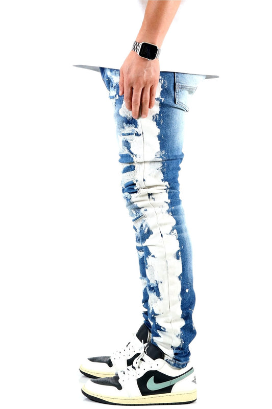 Side view of blue distressed skinny jeans showcasing ripped details.