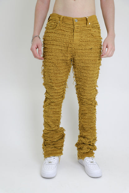 Front view of yellow slim fit jeans with pockets.