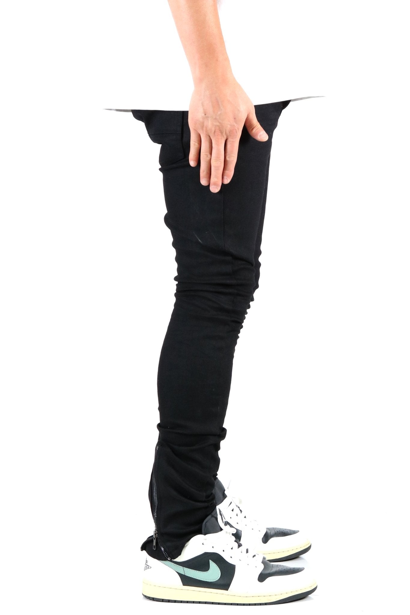 Back view of the black skinny jeans with pocket details