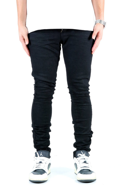 Front view of the black skinny jeans with pocket details