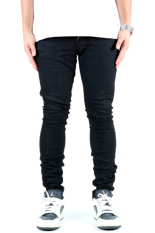 Front view of the black skinny jeans with pocket details