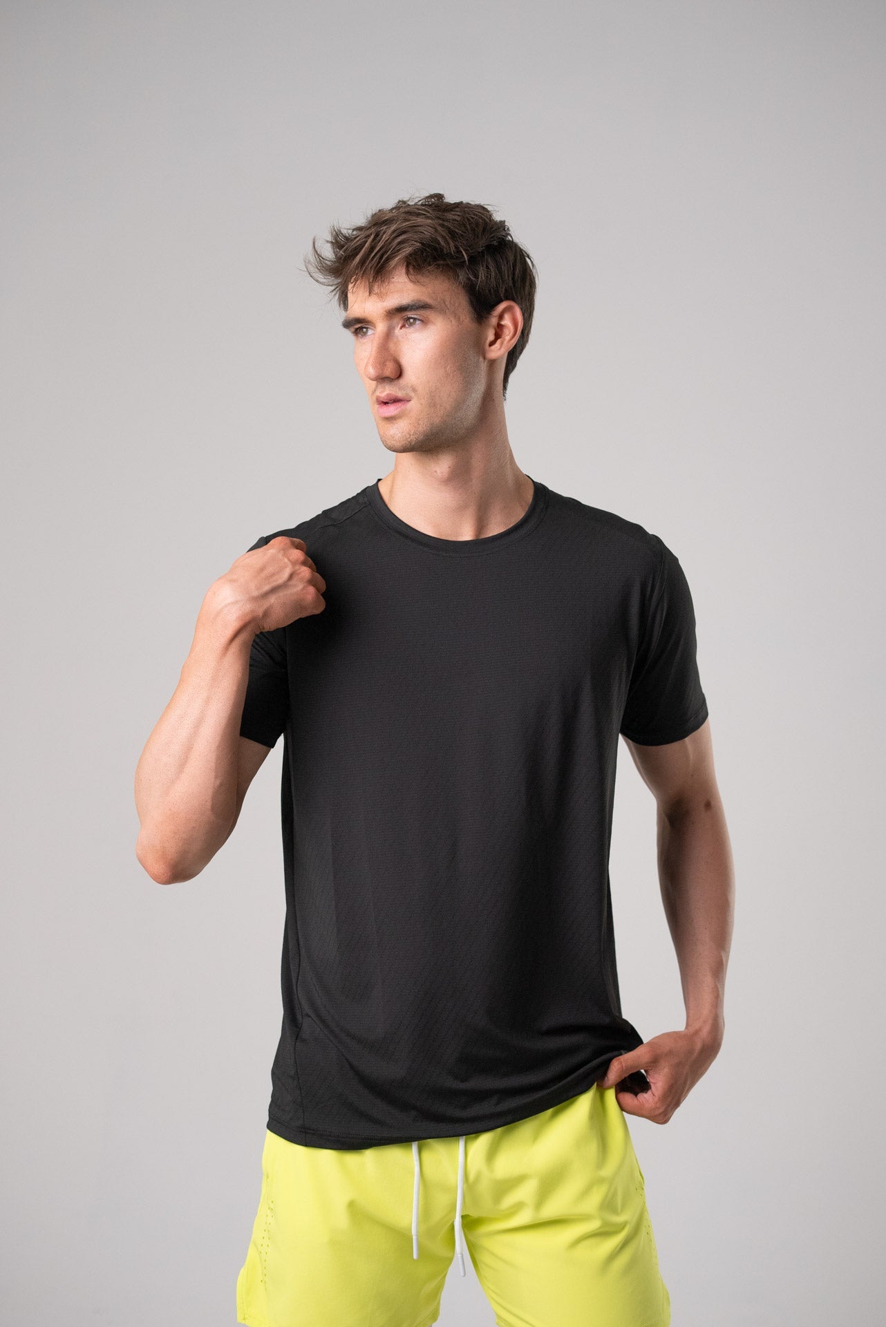 Front view of the black active tee with casual fit.