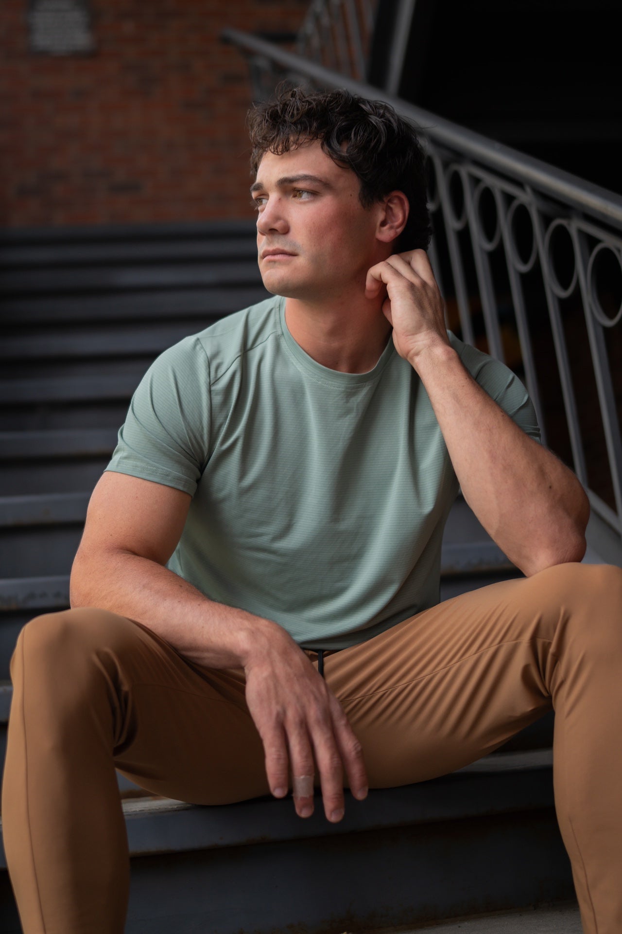 Side view of the blue active tee showcasing short sleeves and round neckline.