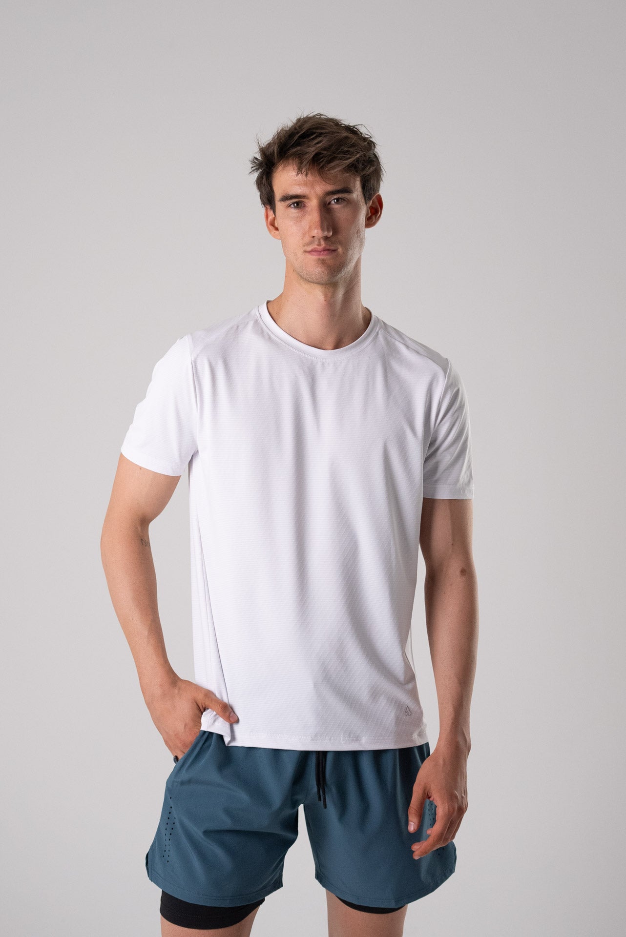 Side view of the white Alive Strong Tee featuring short sleeves.