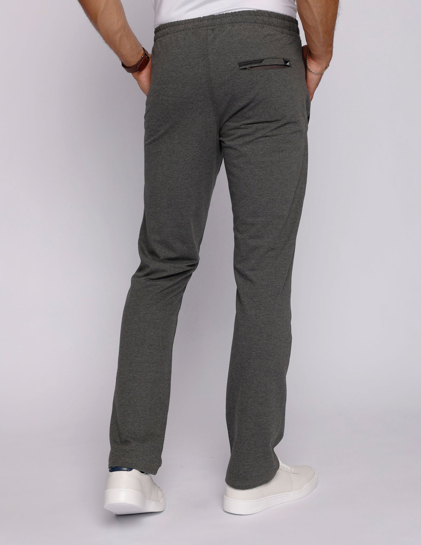 Back view of men's gray sweatpants highlighting a slim fit and back pocket.