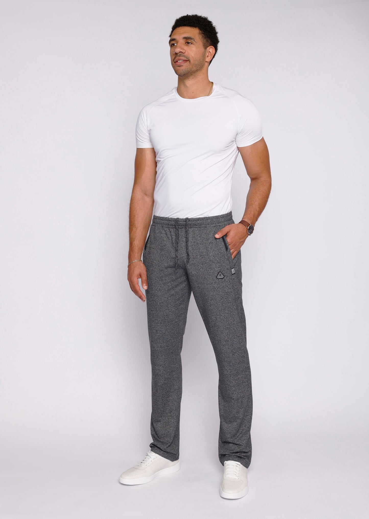 Front view of gray athletic pants with pockets and a casual fit.
