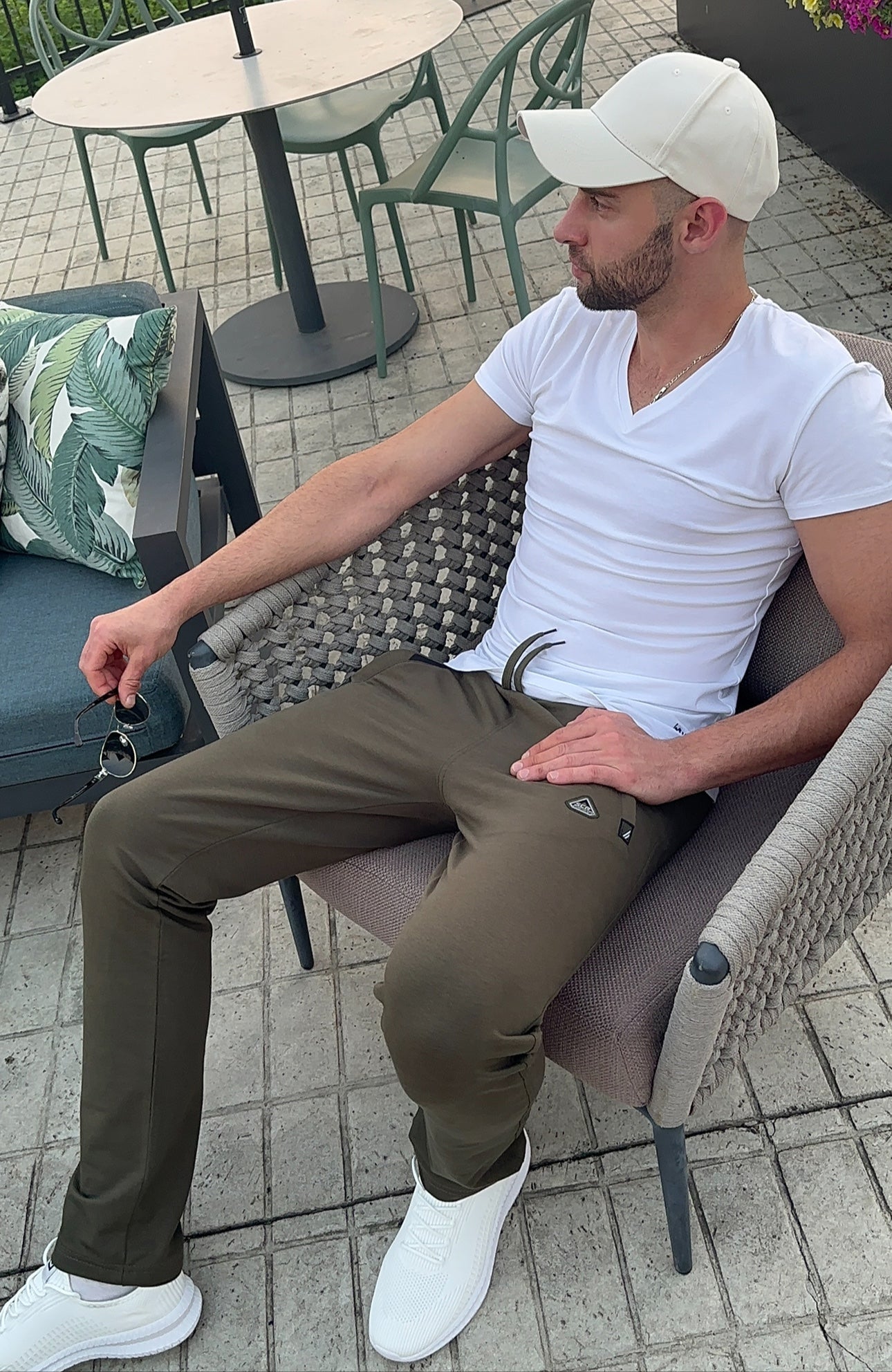 Lifestyle shot of khaki green lounge pants featuring a comfortable fit.