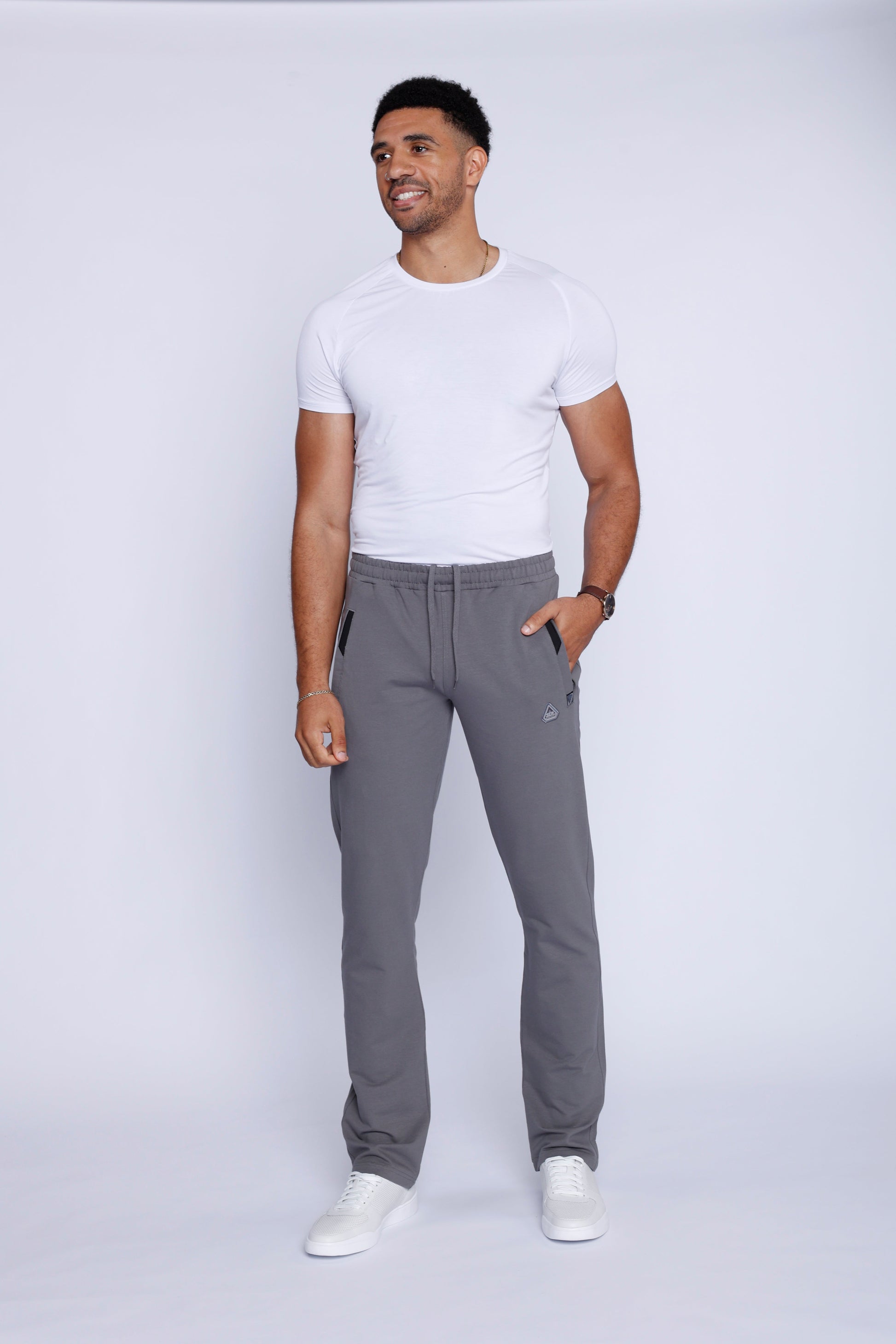 Front view of lightweight grey sweatpants showcasing breathable fabric and elastic waistband.