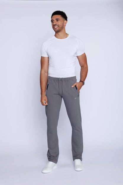 Front view of lightweight grey sweatpants showcasing breathable fabric and elastic waistband.