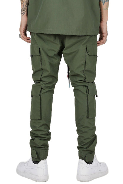 Back view of the green cargo pants highlighting pocket details and drawstring