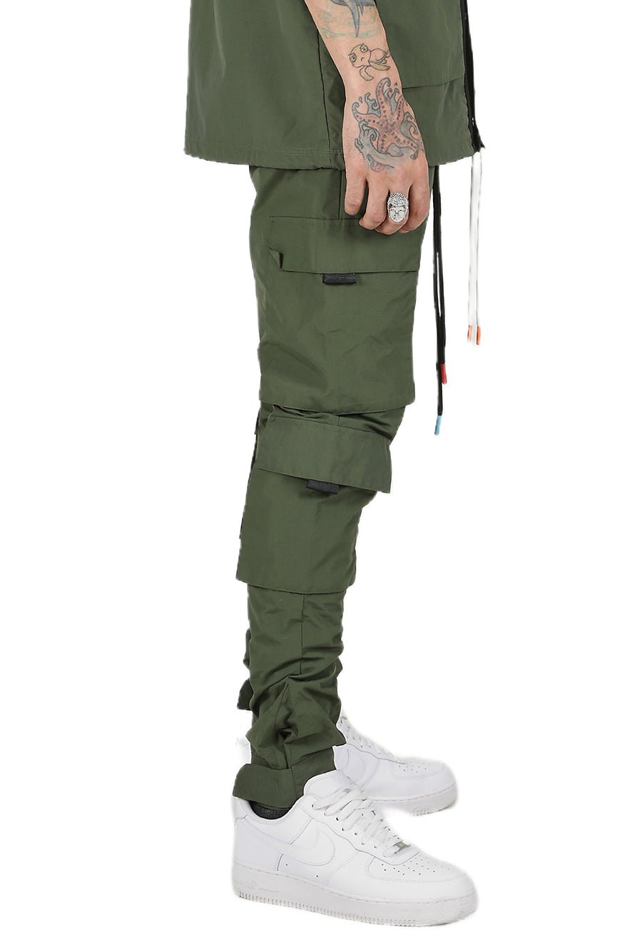 Back view of the green cargo pants featuring pocket details and elastic cuffs