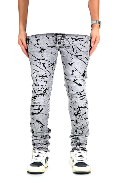 Front view of black and white graphic print skinny denim pants.