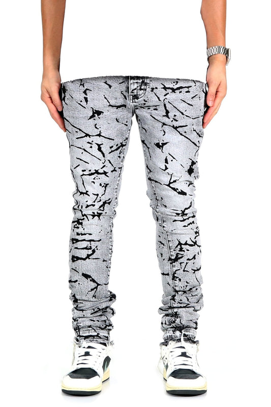 Front view of black and white graphic print skinny denim pants.