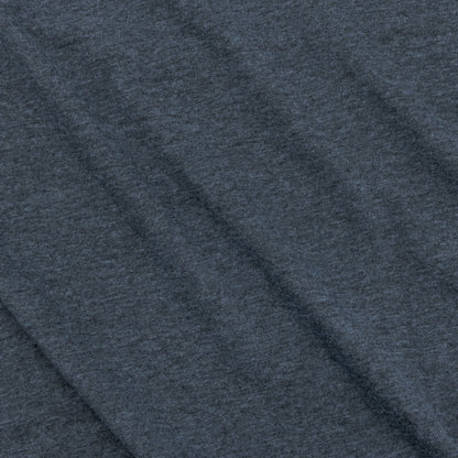 Close-up of the fabric texture showing the soft feel of the navy t-shirt.