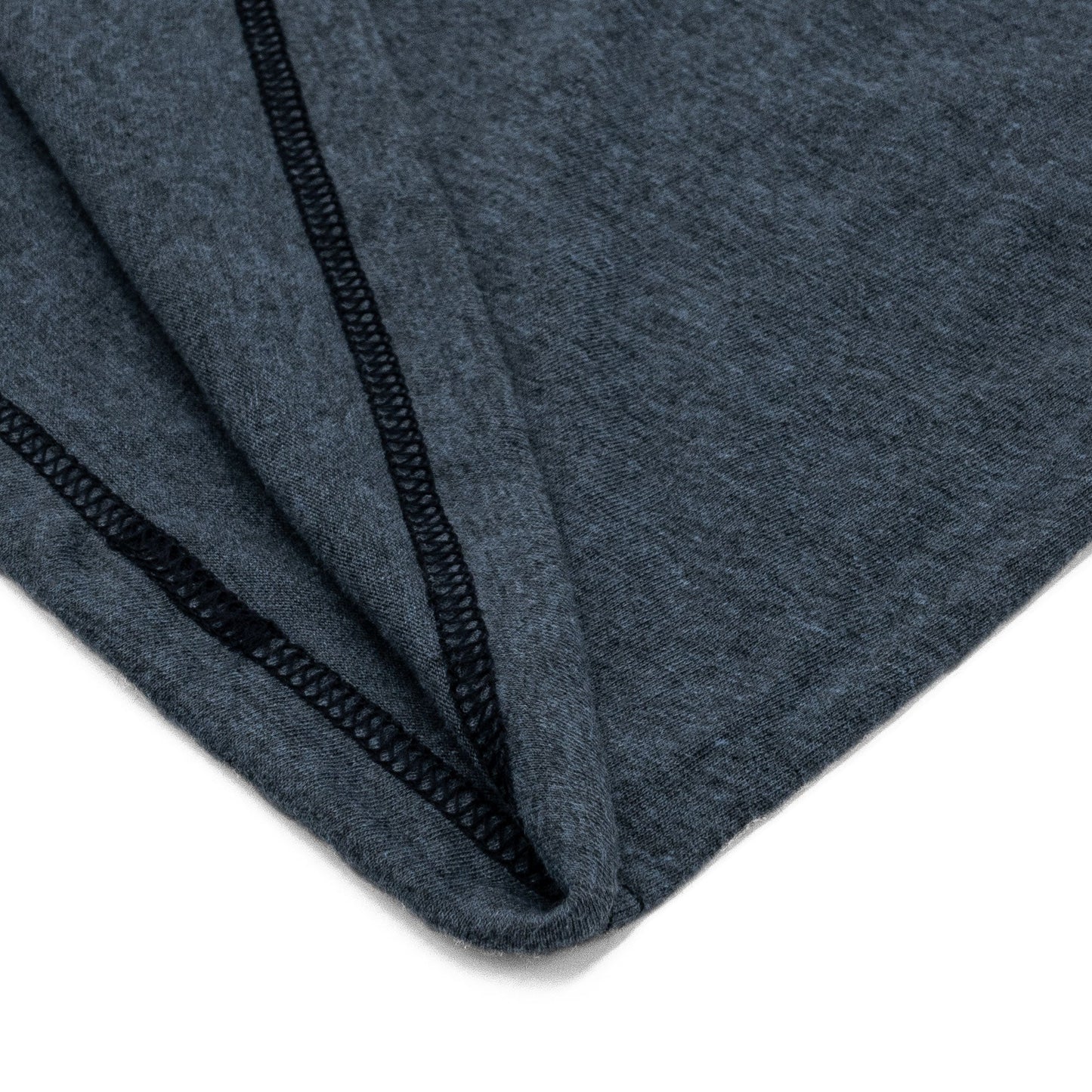 Detail view of the hem of the navy t-shirt featuring a folded hem and clean finish.