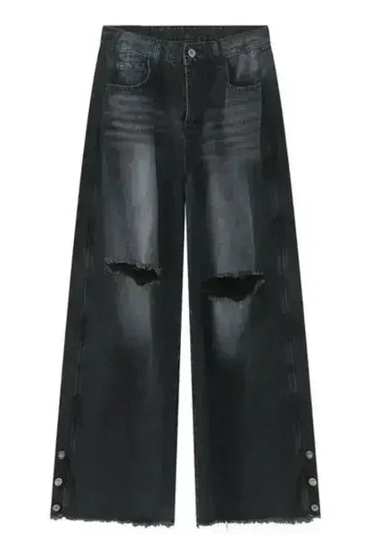 Front view of black jeans with wide leg and distressed details.