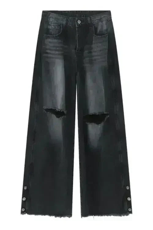 Front view of black jeans with wide leg and distressed details.
