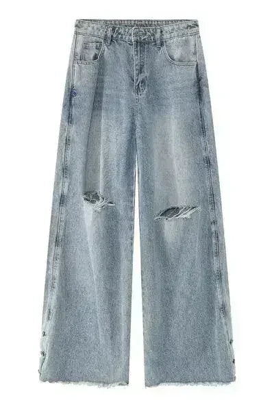 Front view of light blue jeans featuring wide leg and distressed details.