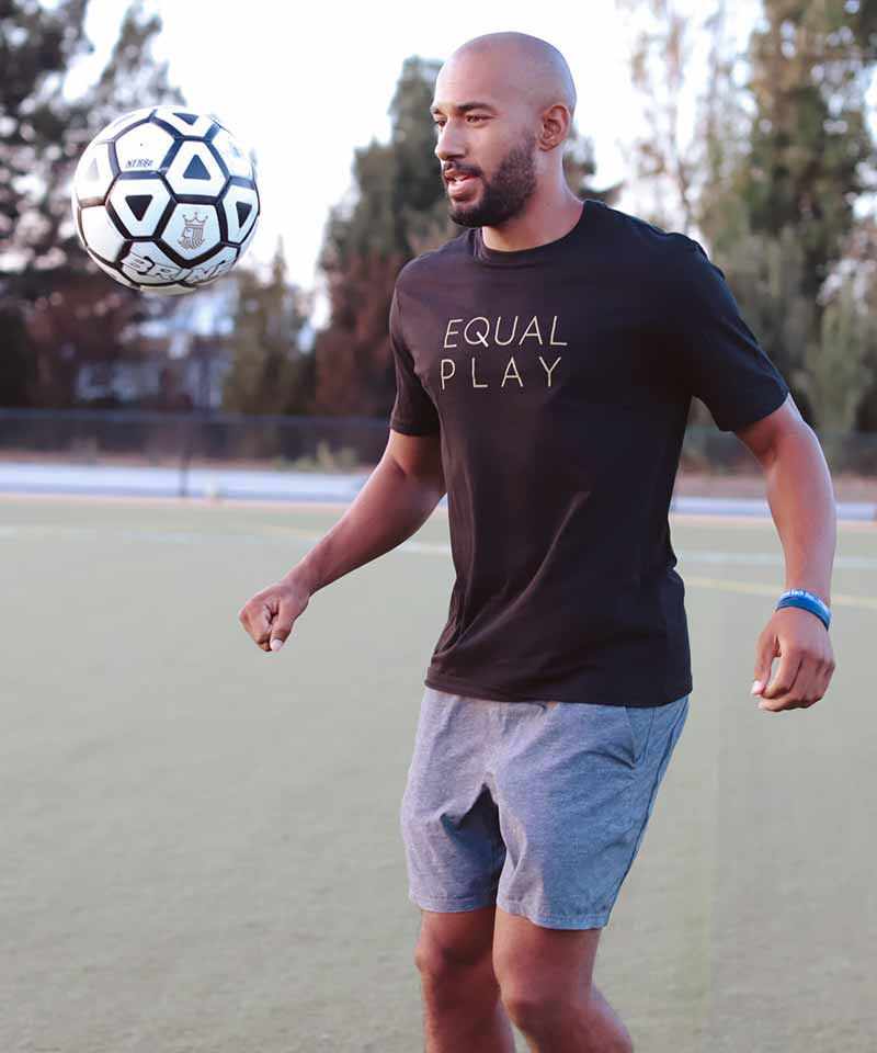 Lifestyle shot of the black t-shirt featuring text print and short sleeves