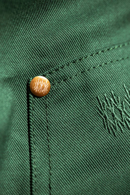 Close-up detail of the cotton twill fabric showing stitched texture.