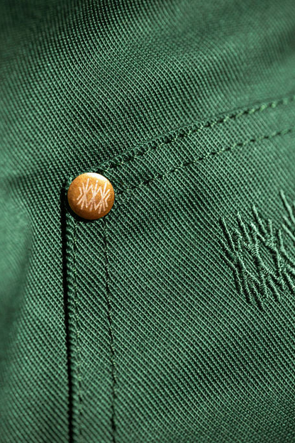 Close-up detail of the cotton twill fabric showing stitched texture.