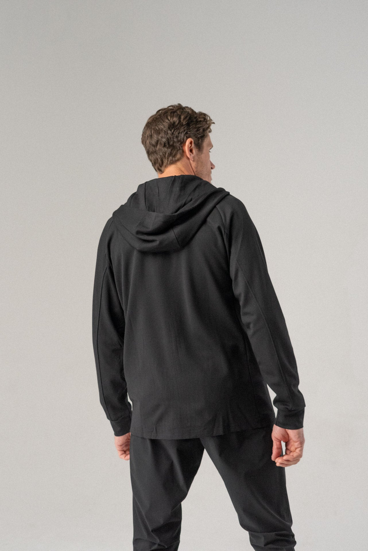 Back view of the black Fierce Hooded Jacket displaying the hood.