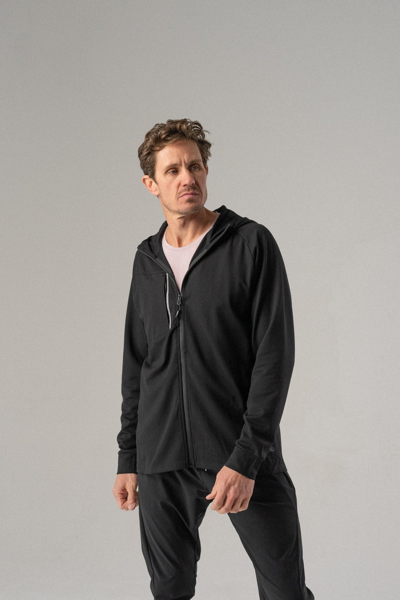 Front view of the black Fierce Hooded Jacket with zipper closure.