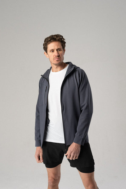 Lifestyle view of the dark grey Fierce Hooded Jacket worn by a model.