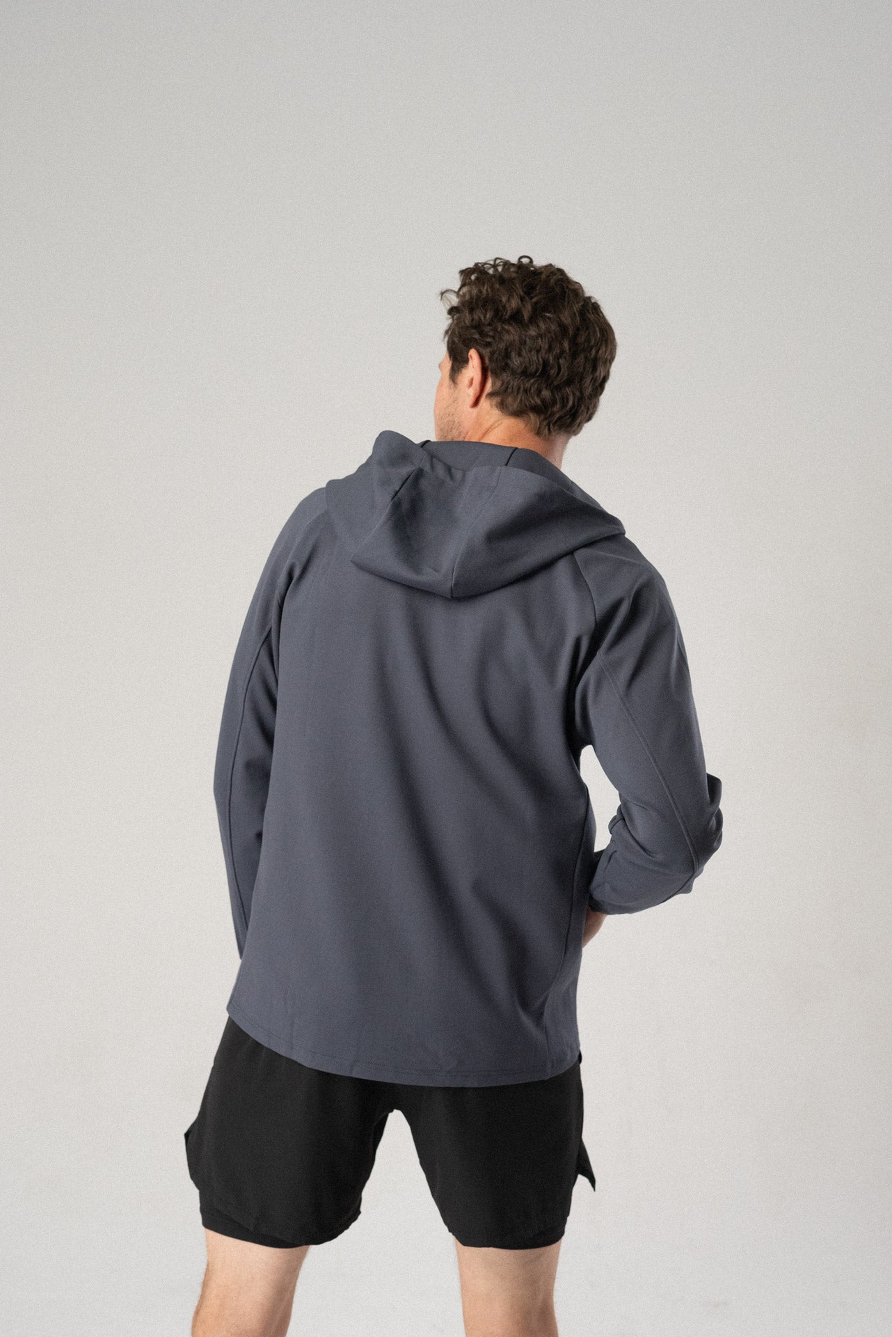 Front view of the white Fierce Hooded Jacket with zipper closure.