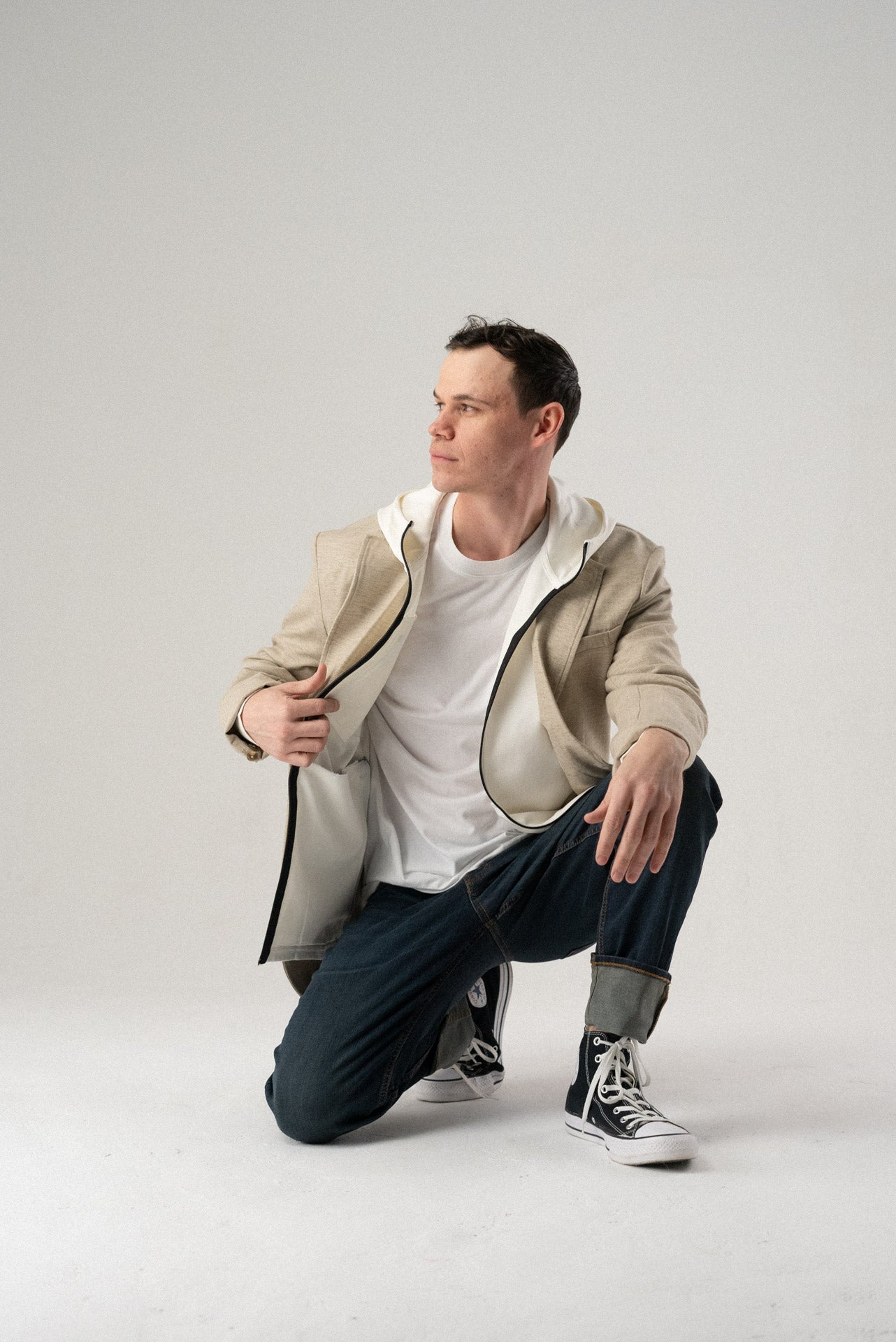 Side view of the white Fierce Hooded Jacket featuring long sleeves.