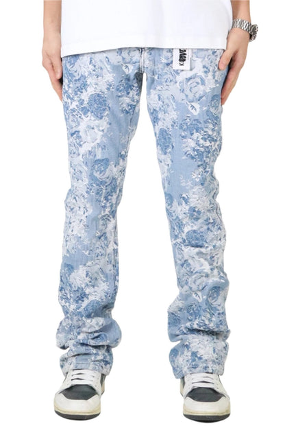 Front view of light blue jacquard denim pants with a distressed design.