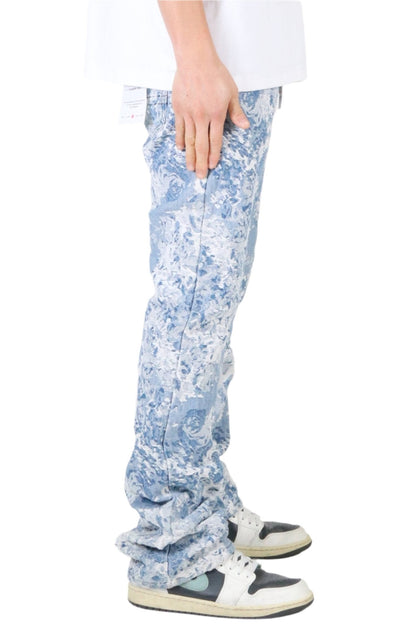 Side view of light blue jacquard denim pants highlighting the fitted style.