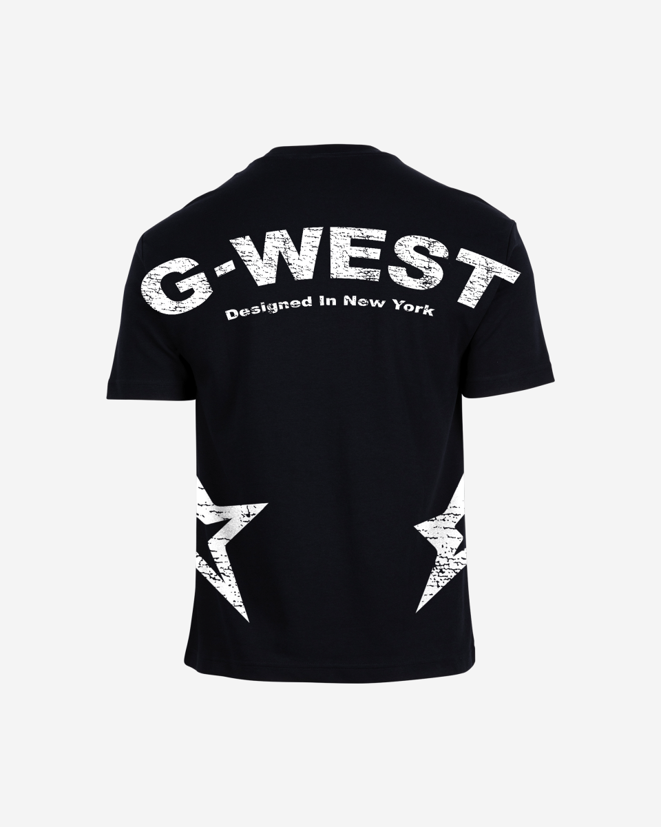 Lifestyle shot of the blue oversized t-shirt featuring G-WEST logo in a studio environment.