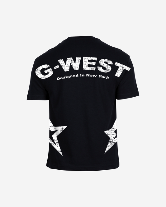 Lifestyle shot of the blue oversized t-shirt featuring G-WEST logo in a studio environment.
