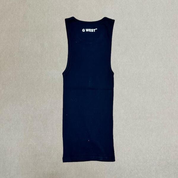 Back view of the navy oversized cotton gym tank with plain design