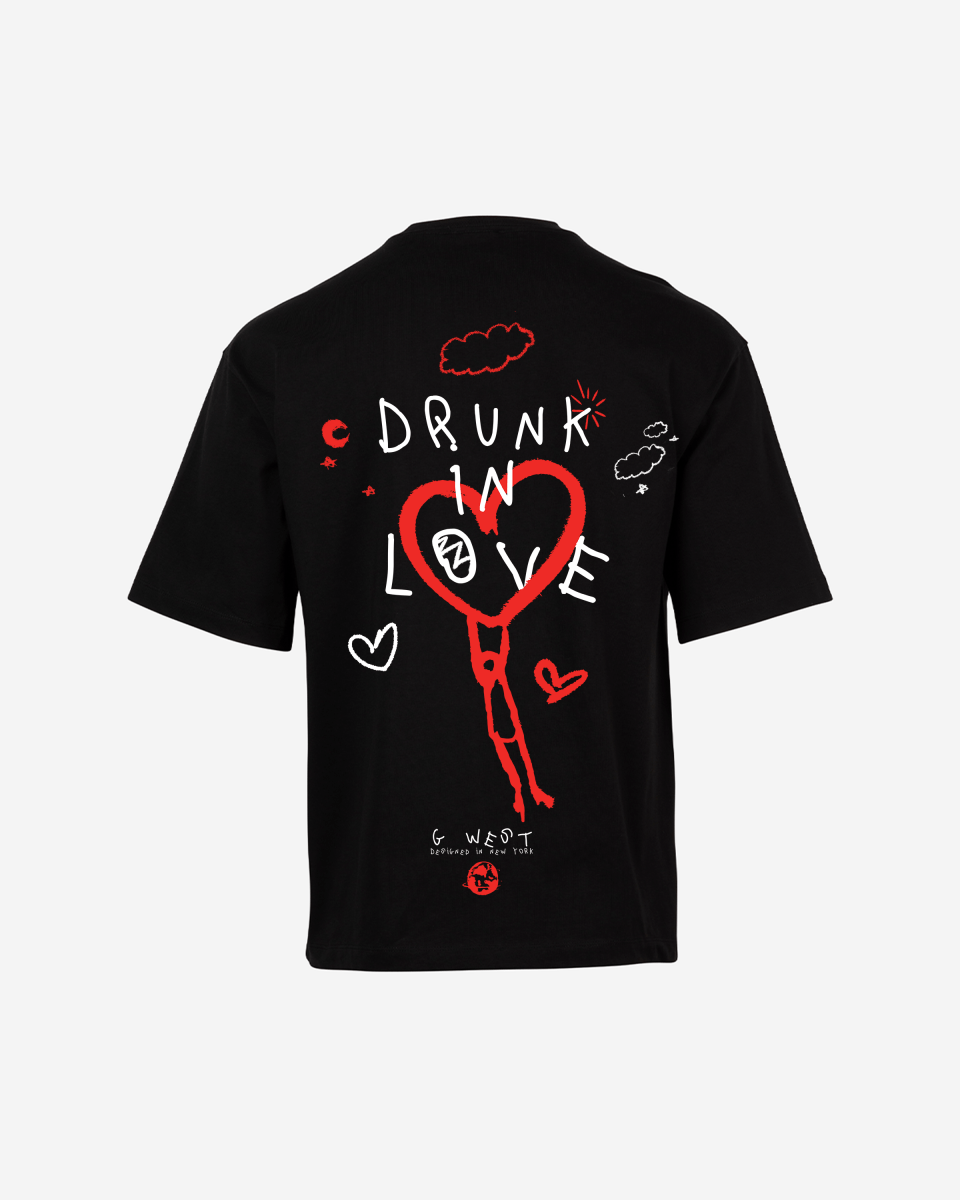 Packaging shot of the black oversized t-shirt featuring back print and graphic design.