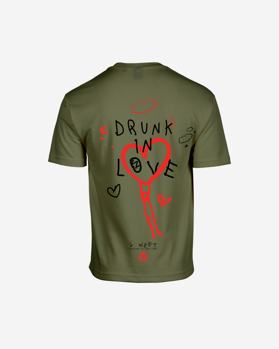 Back view of the olive green oversized tee with graphic print.