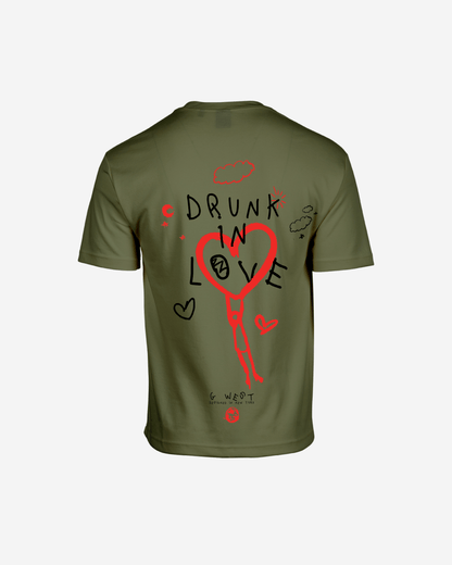 Back view of the olive green oversized tee with graphic print.