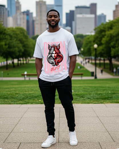 Man wearing a graphic t-shirt in a casual setting with a natural background.