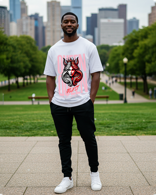 Man wearing a graphic t-shirt in a casual setting with a natural background.