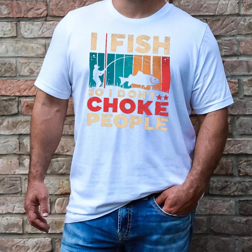 White t-shirt showcasing graphic text in a natural setting.