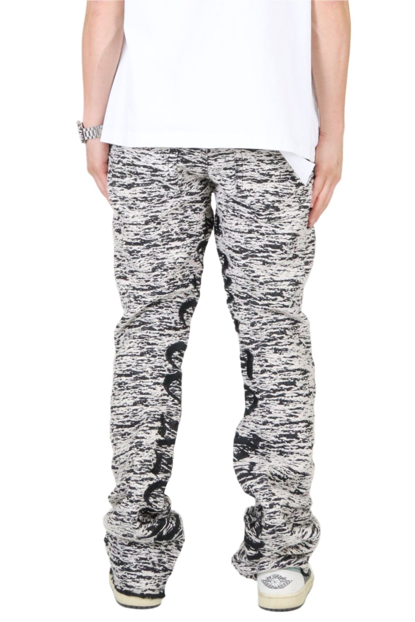 Side view of the black and white jacquard pattern casual style denim pants.