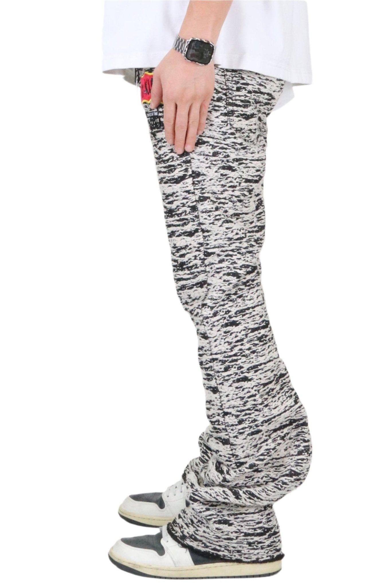 Back view of the black and white jacquard pattern loose fit denim pants.