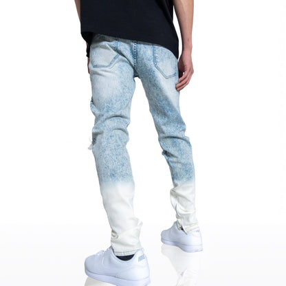 Back view of blue jeans highlighting the faded design.