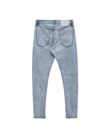 Back view of light blue jeans with back pockets on a white background
