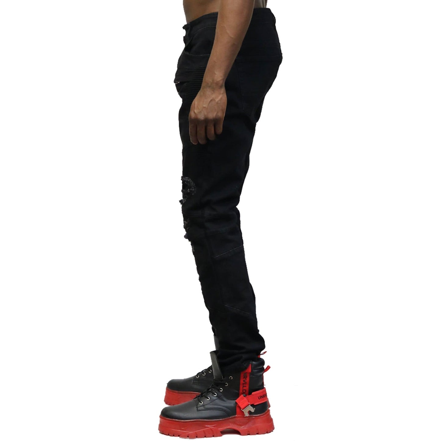 Back view of the black denim pants with rip-off details.