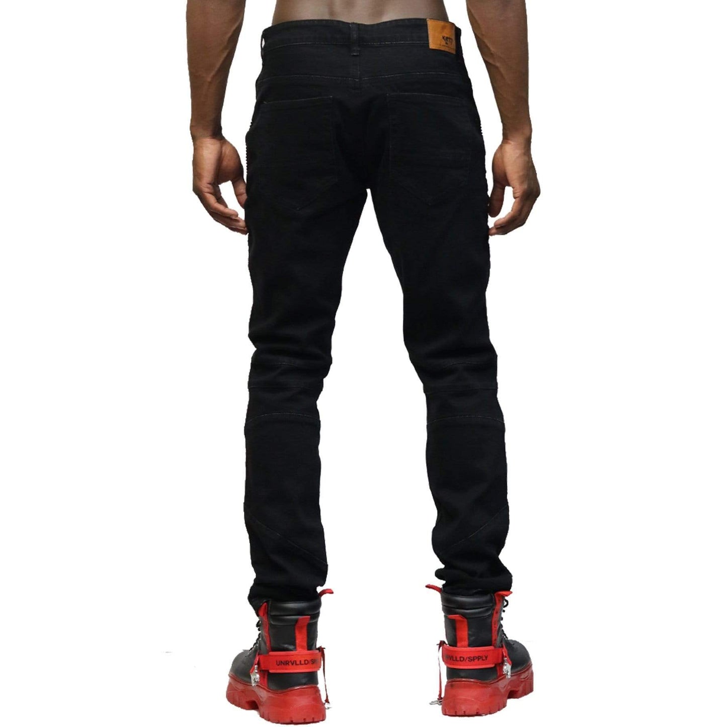 Back view of the black denim pants highlighting the biker padding effects.