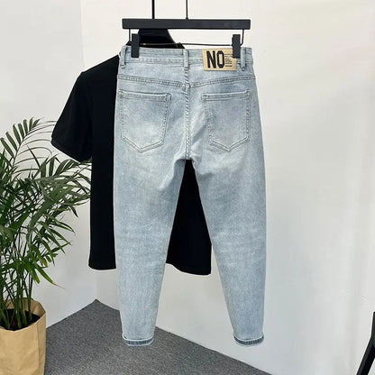 Back view of light blue skinny jeans with a tag on the waistband.