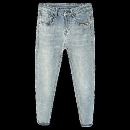 Front view of light blue skinny jeans with distressed details and five pockets.